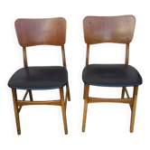 Set of 2 vintage Scandinavian chairs in teak and black faux leather by Kofod-Larsen, Denmark, 1960s.