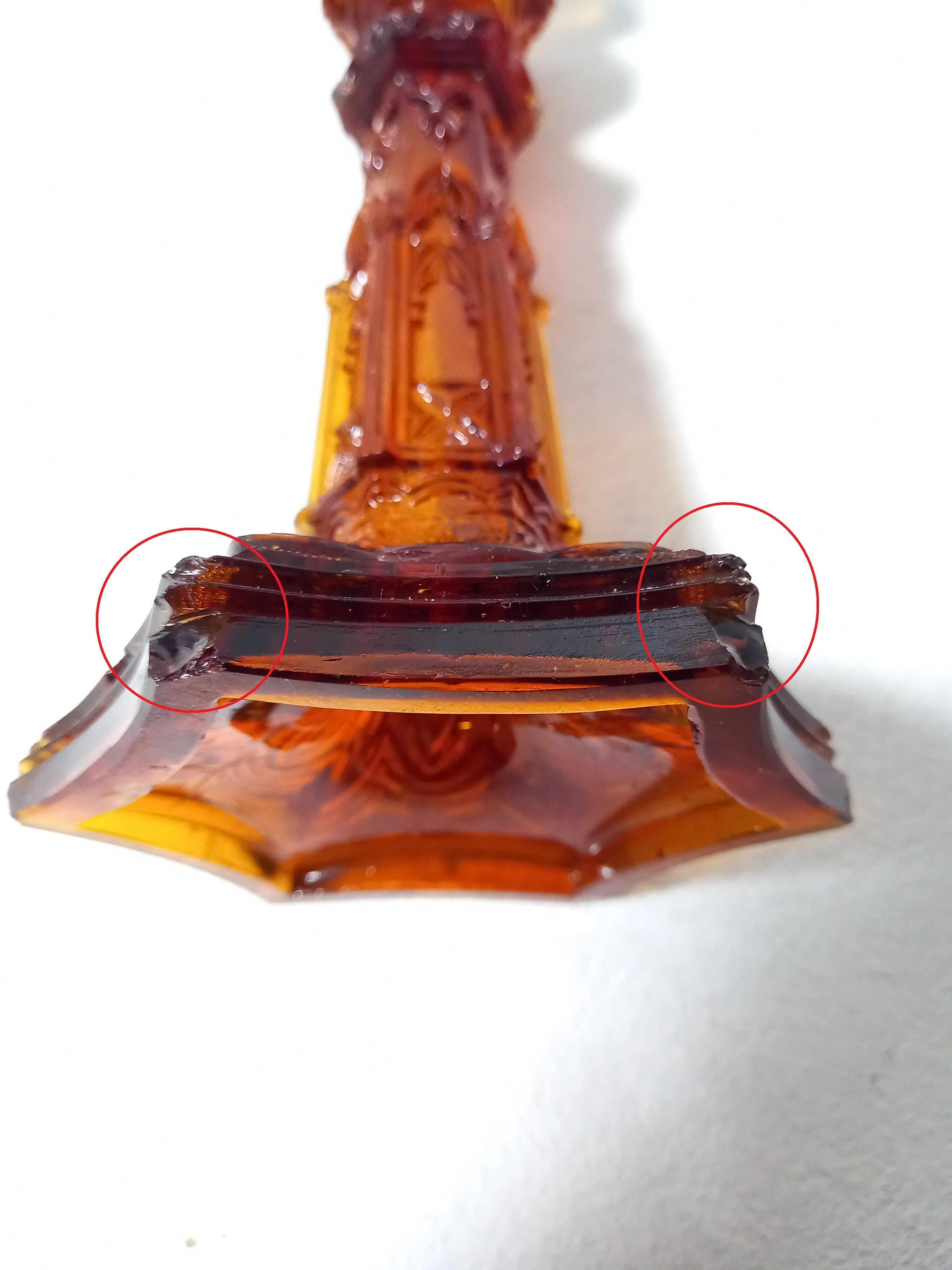 Pair of amber glass torches decorated with gothic motifs