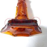 Pair of amber glass torches decorated with gothic motifs