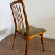 Scandinavian chairs with green velvet upholstery.