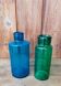 A pair of blue and green glass vases.