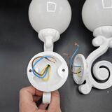 Pair of white enameled cast iron wall sconces, mid-20th century