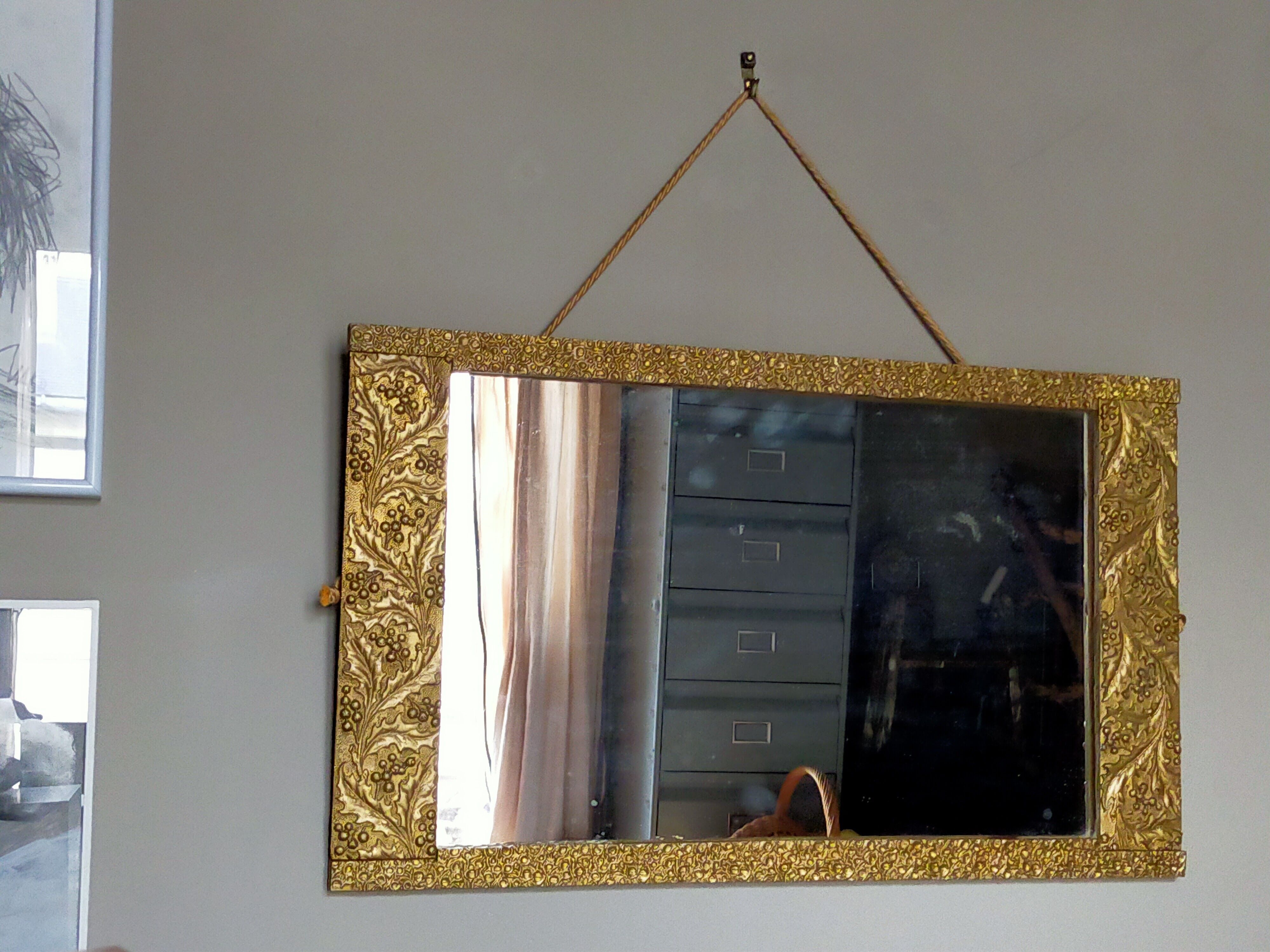 Art-deco gold mirror with vegetal décor  52x31cm