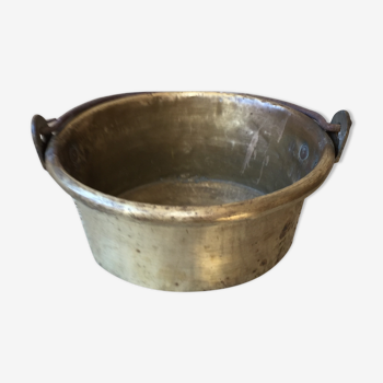 Basin cauldron or old garden in yellow copper