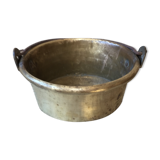 Basin cauldron or old garden in yellow copper