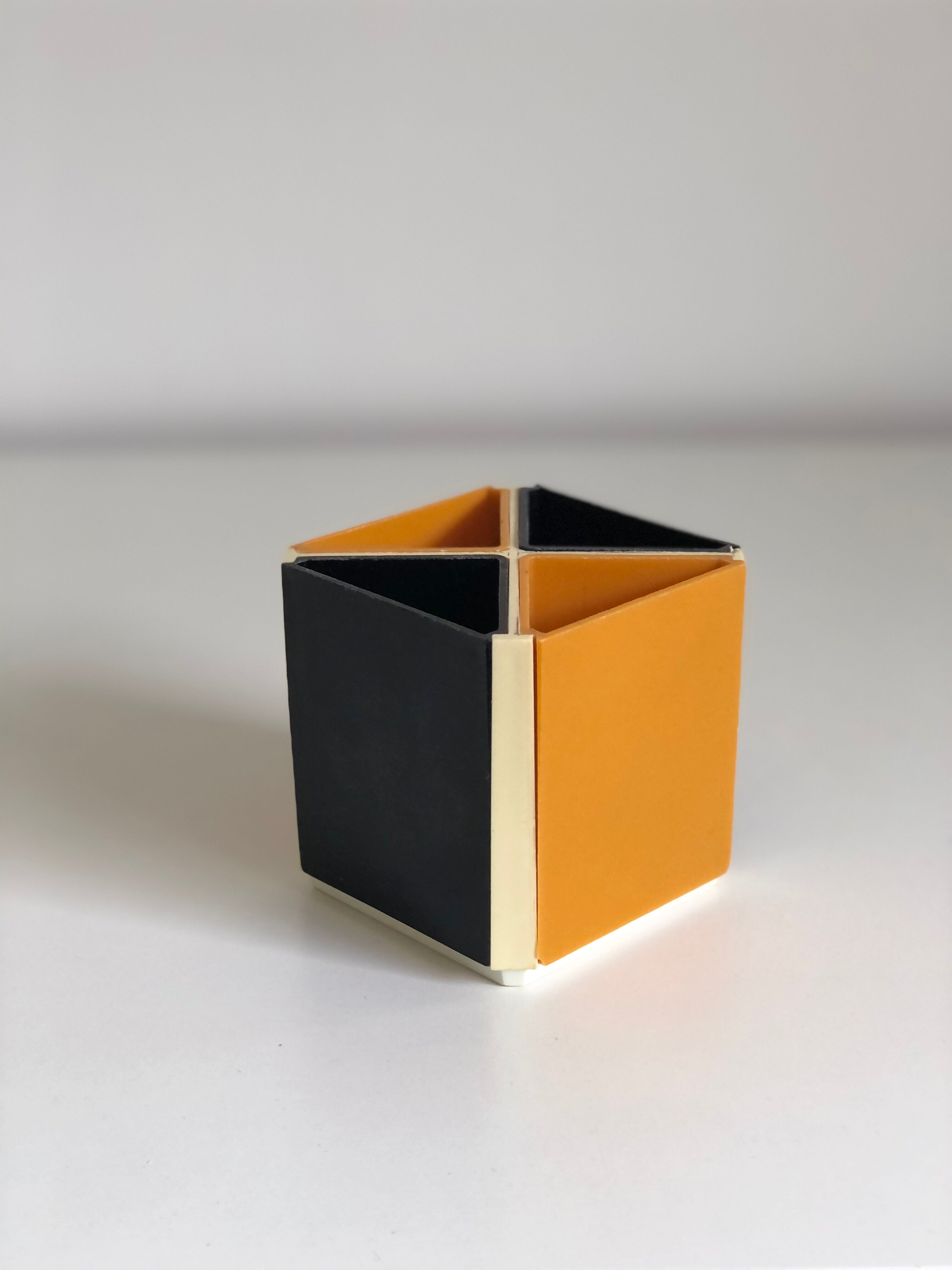 Black and orange plastic compartment pencil pot, 1970