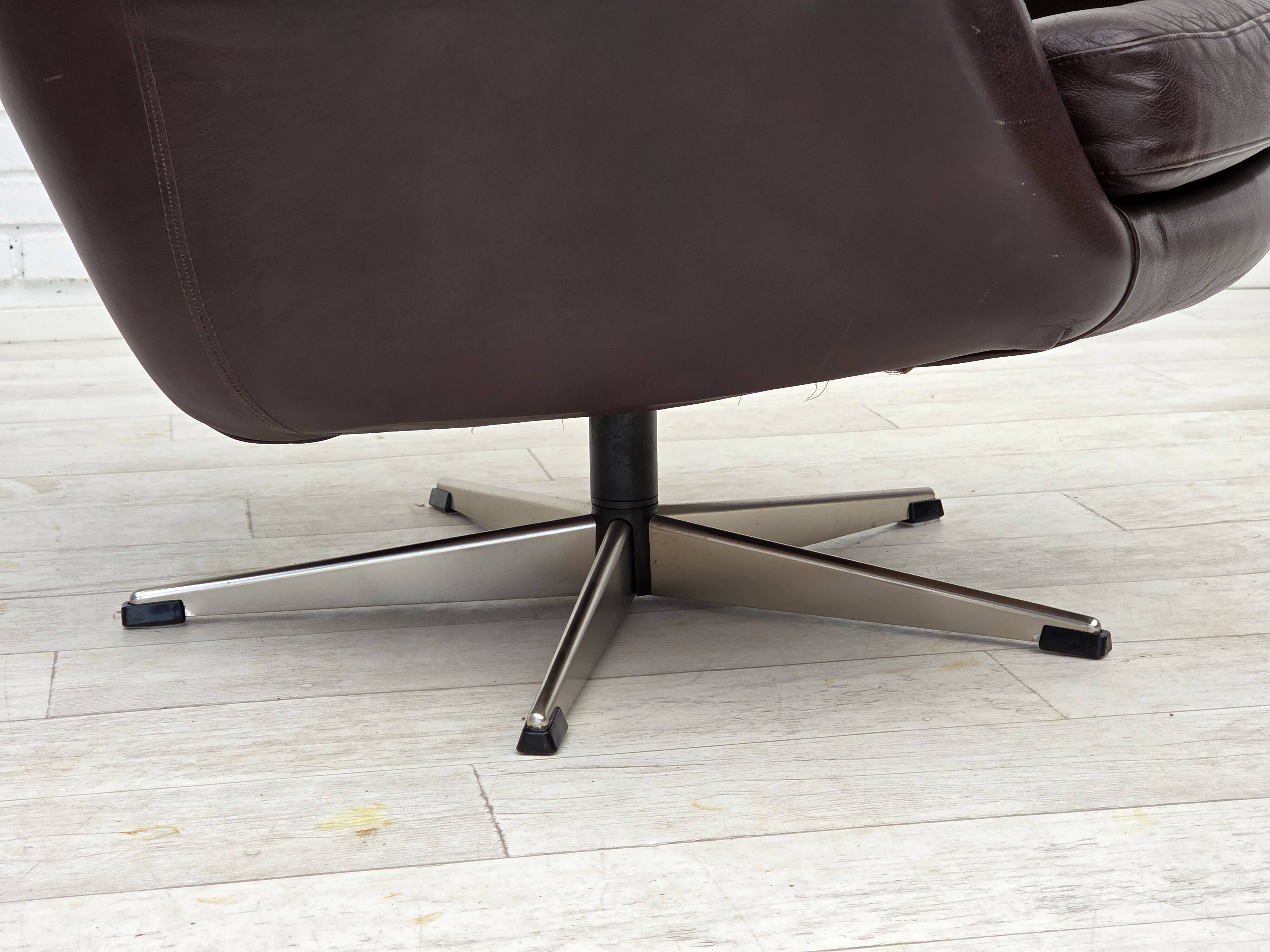 1970s, set of two swivel lounge chairs with footstool, leather.