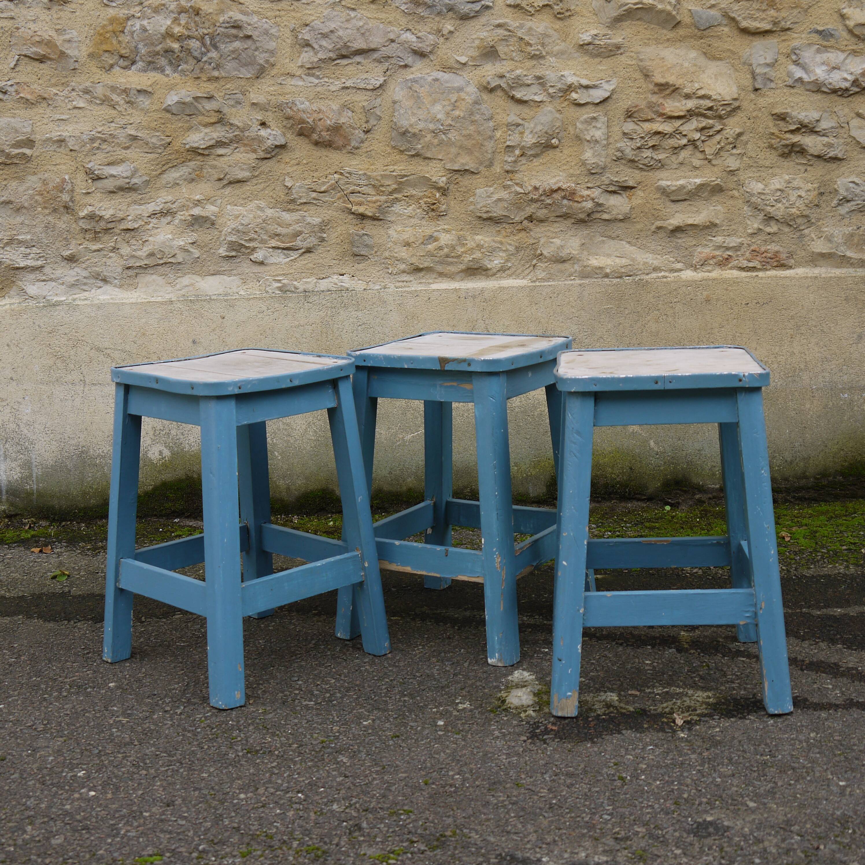 Three blue wooden stools