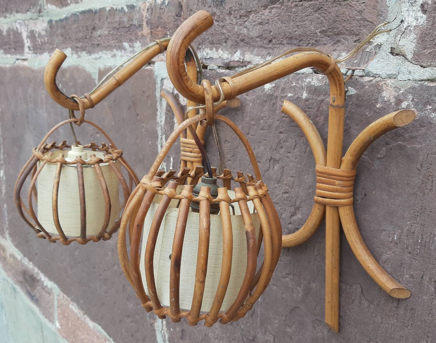 Pair of Louis Sognot rattan wall lights.