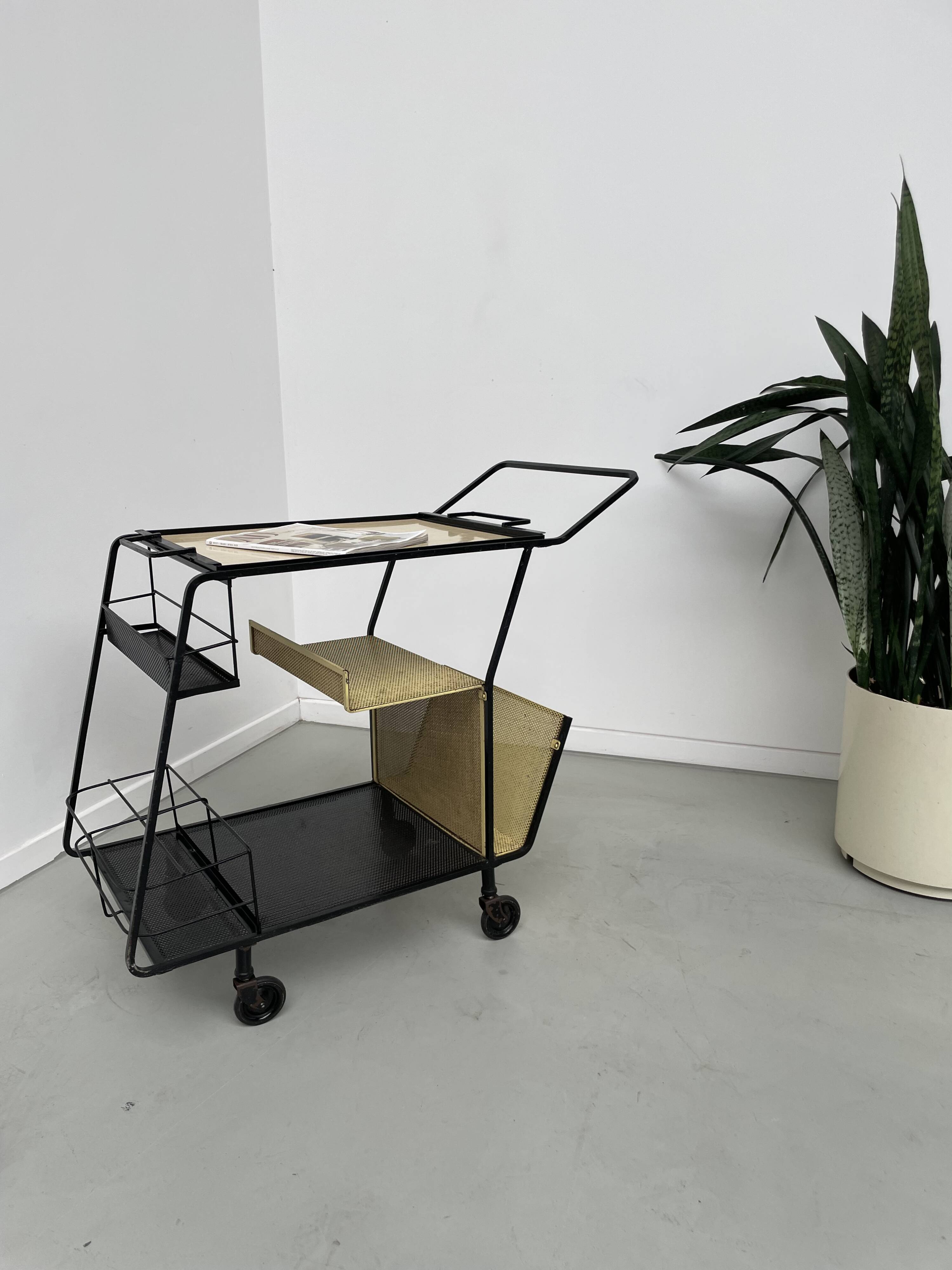 Perforated metal serving trolley in the Mathieu Matégot style