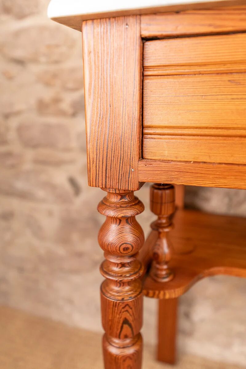 Antique washbasin cabinet in solid pitch pine with a white marble top.