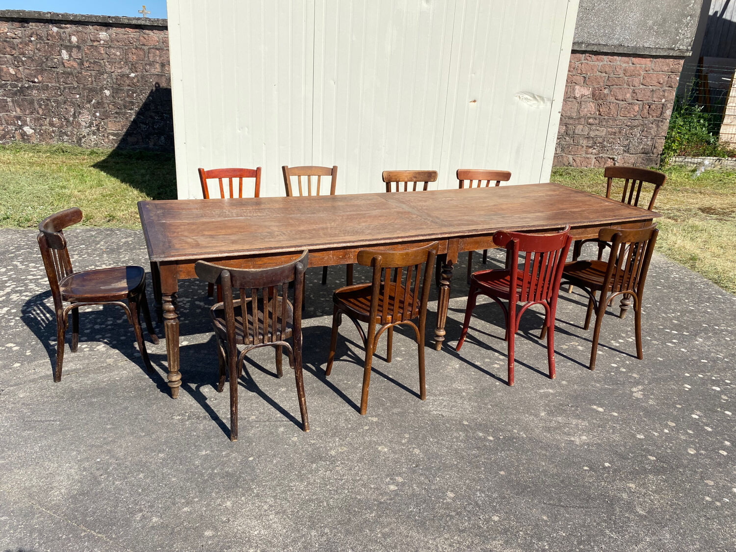 Draper table and its 10 chairs