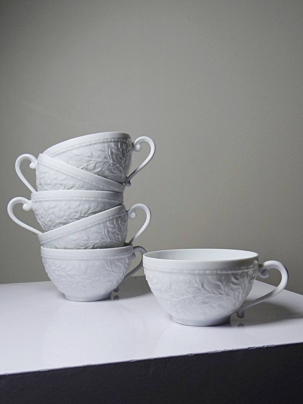 Set of 6 Bernardaud Limoges Louvre model white porcelain cups.
