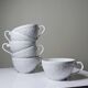 Set of 6 Bernardaud Limoges Louvre model white porcelain cups.