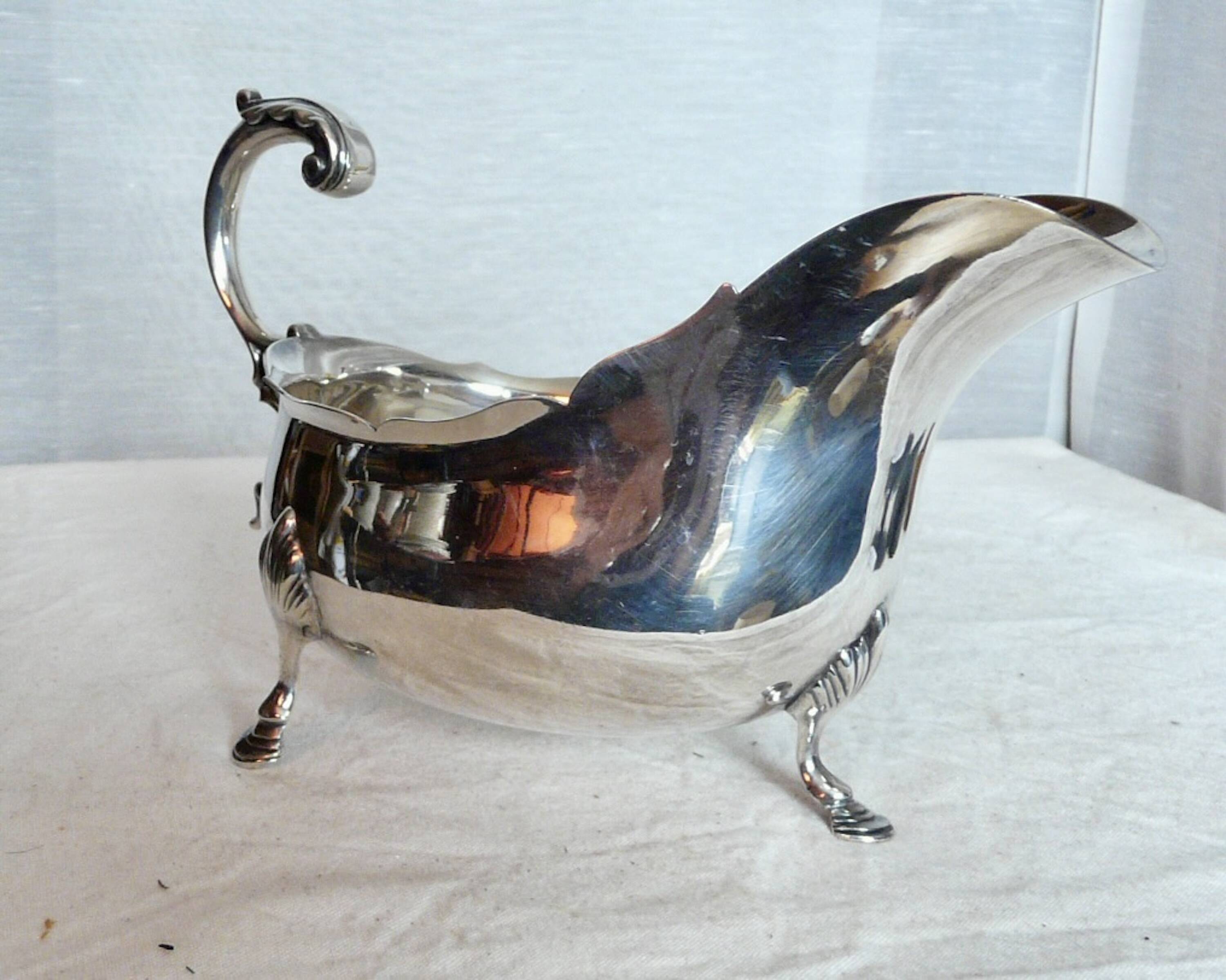Empire style silver metal sauce boat