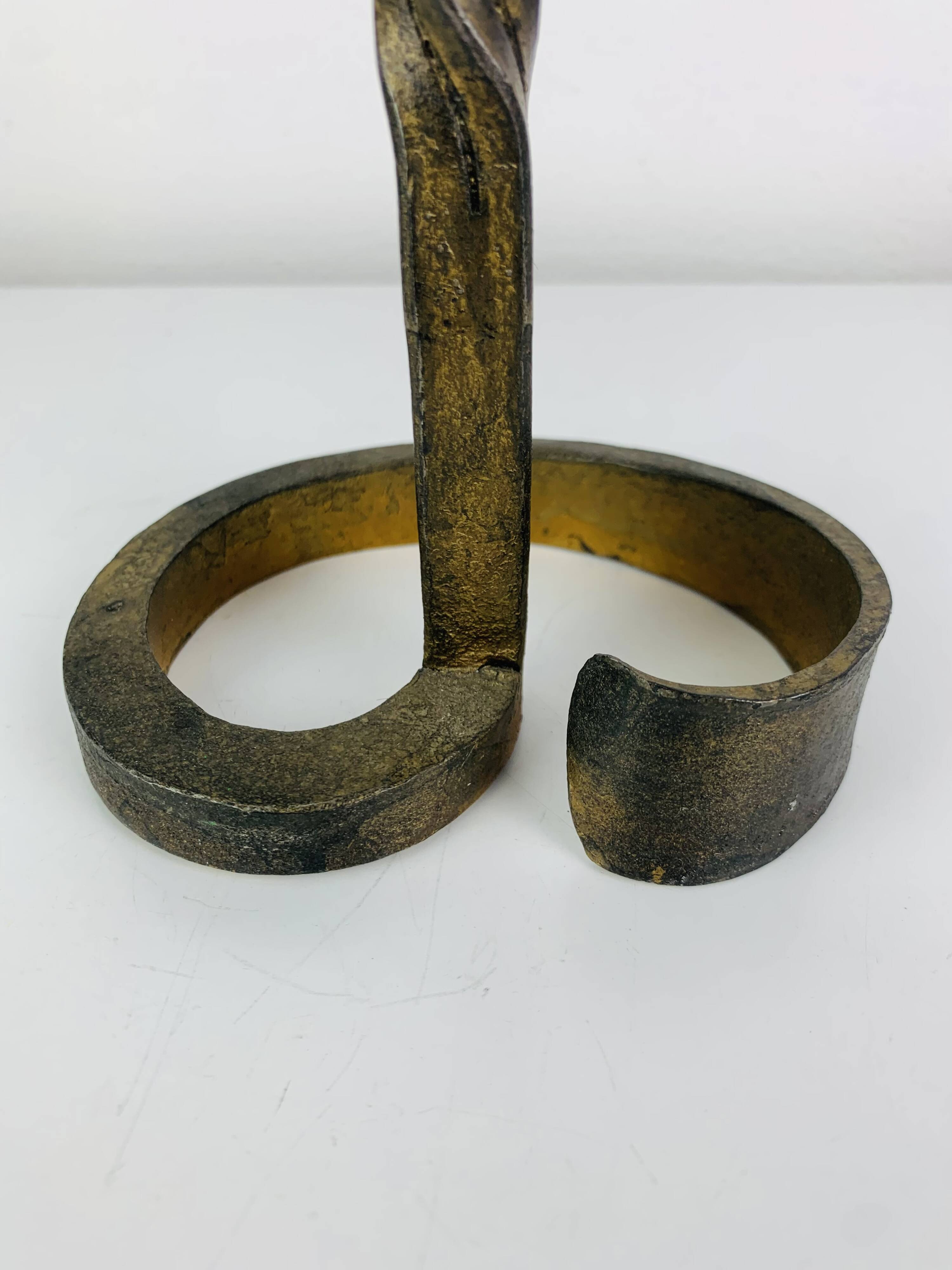 Brutalist candle holder, wrought iron with a golden patina.