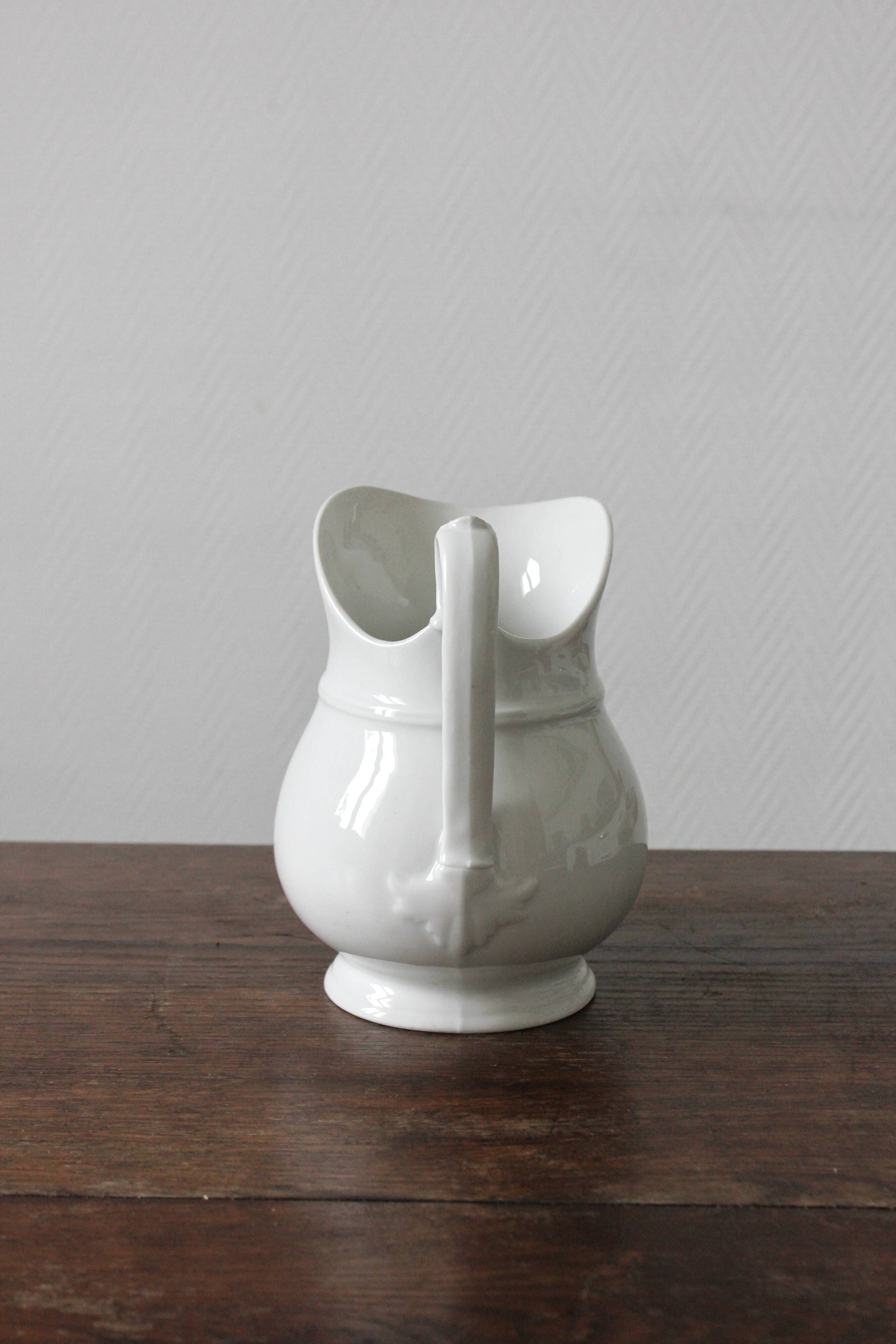Old broc in white earthenware