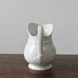 Old broc in white earthenware