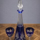 Cobalt blue double crystal service, consisting of a decanter and two matching glasses.
