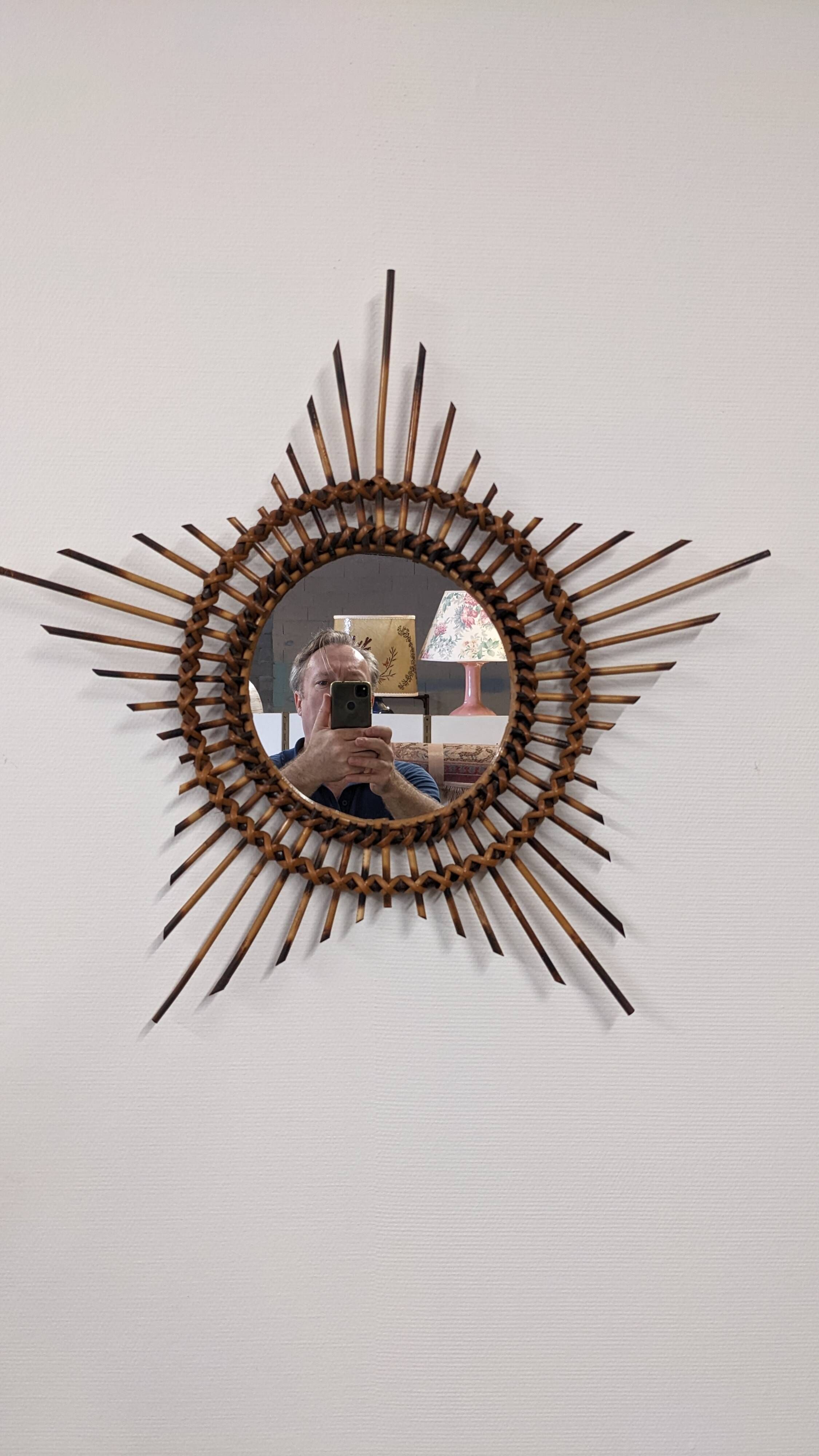 Starry sun mirror in rattan, France around 1960.