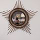 Starry sun mirror in rattan, France around 1960.