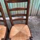 Duo of vintage rustic straw straw chairs in oak.