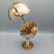 Vintage brass globe cigarette dispenser