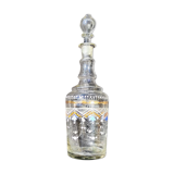 Enamelled decanter with its cap