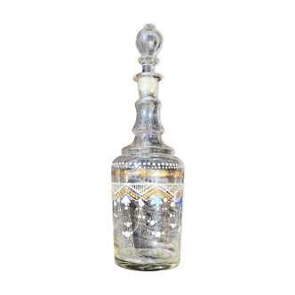 Enamelled decanter with its cap