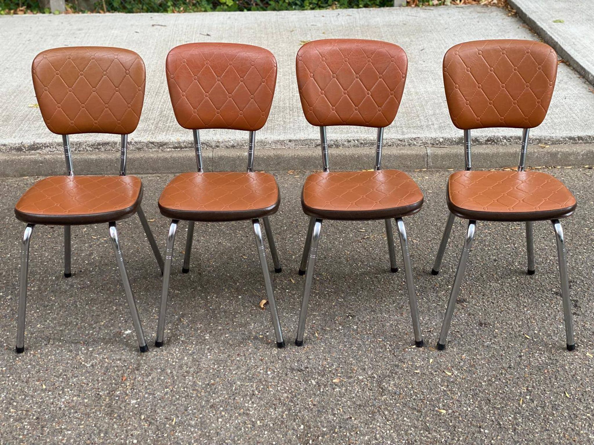 Set of 4 vintage camel faux leather quilted chairs with chrome metal by Soudexvinyl from the 70s.