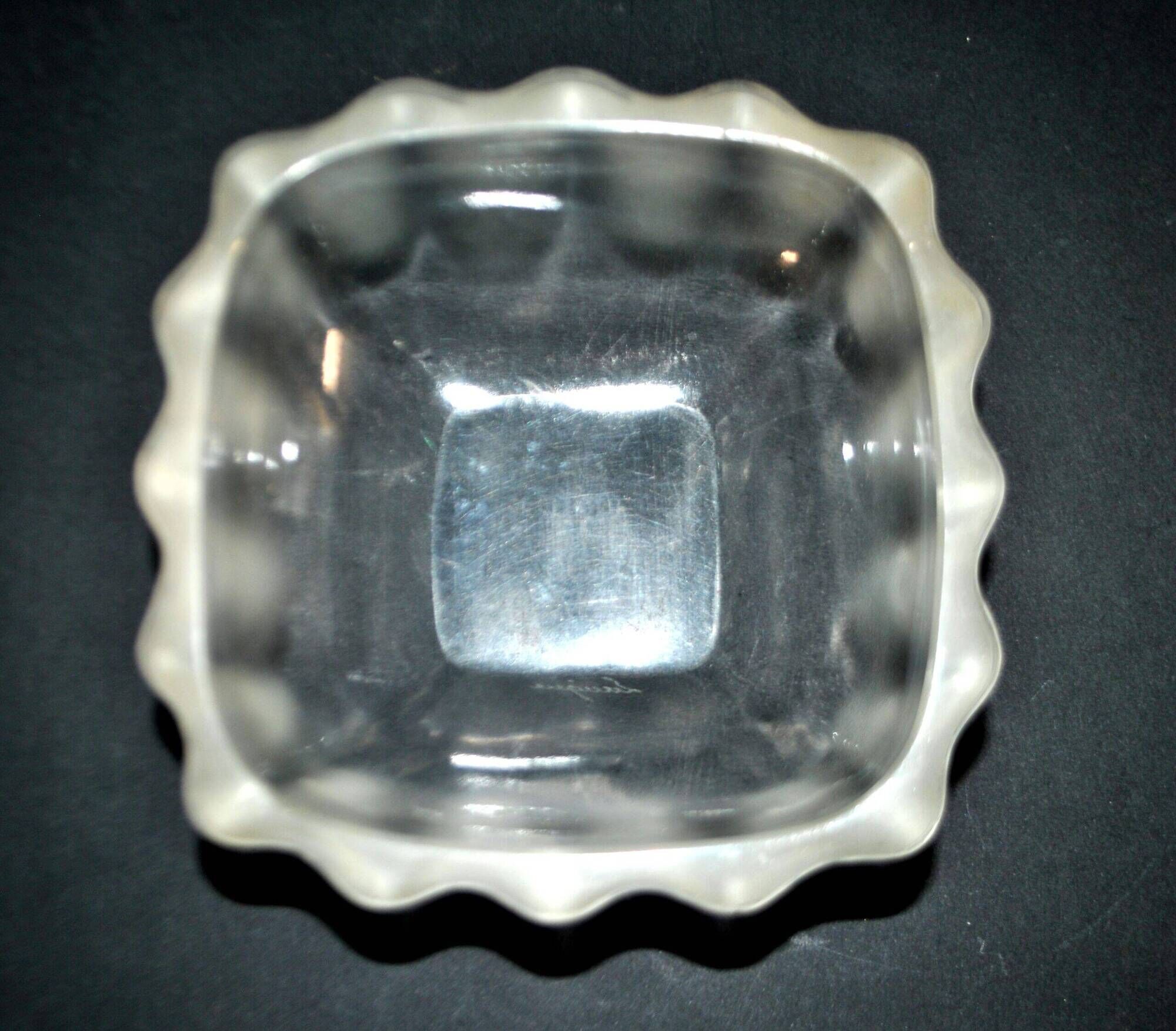 Lalique glass ashtray bowl with frosted finish, engraved with wave design, signed Lalique.