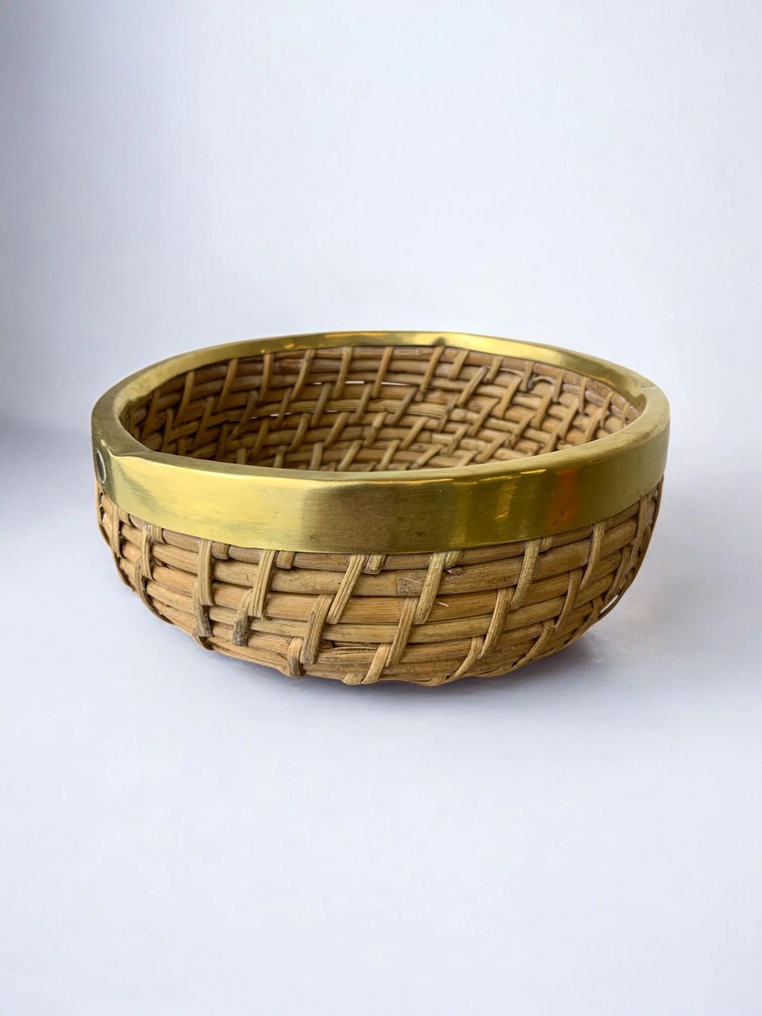 Circular rattan and brass basket, Italy, circa 1970