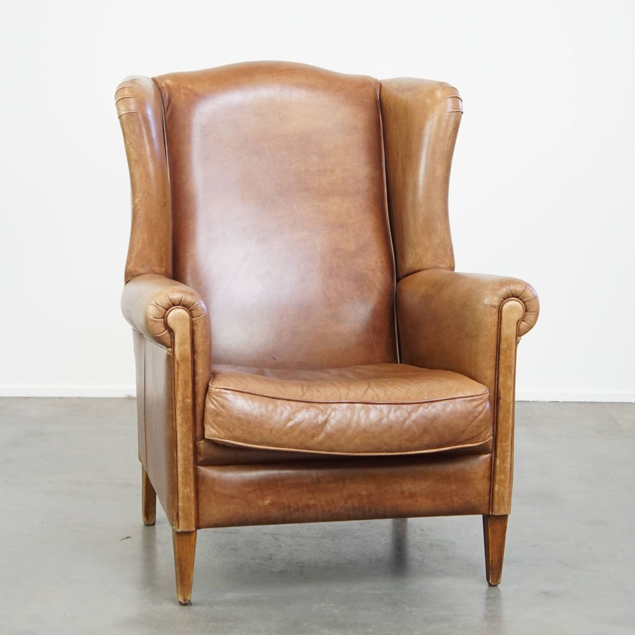Cowhide Leather Wingback Chair in Light Cognac Color
