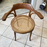 Bistro chair with a curved wooden frame and caned seat from the 1930s.