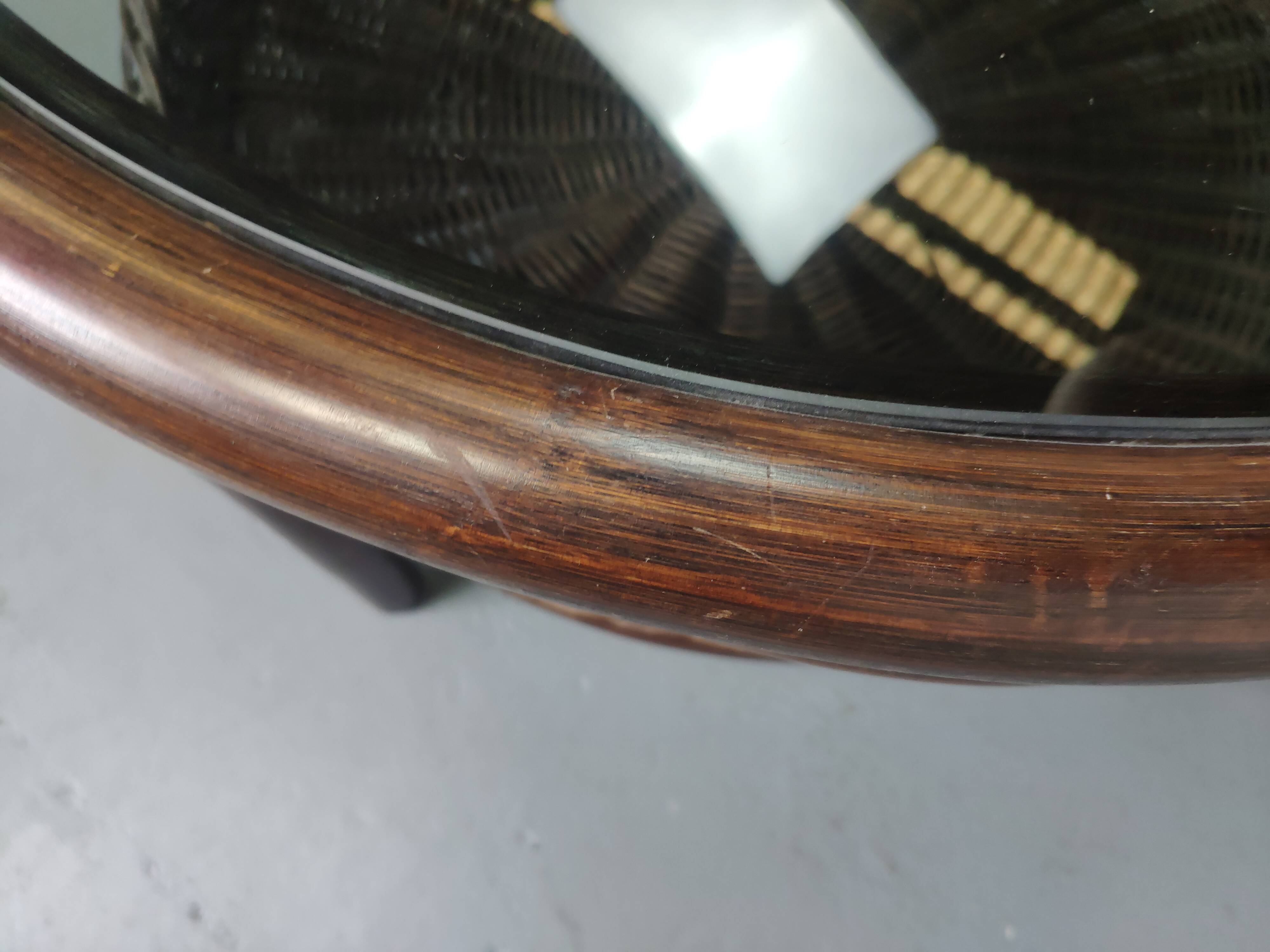 Vintage rattan coffee table with smoked glass top and rattan basket shelf