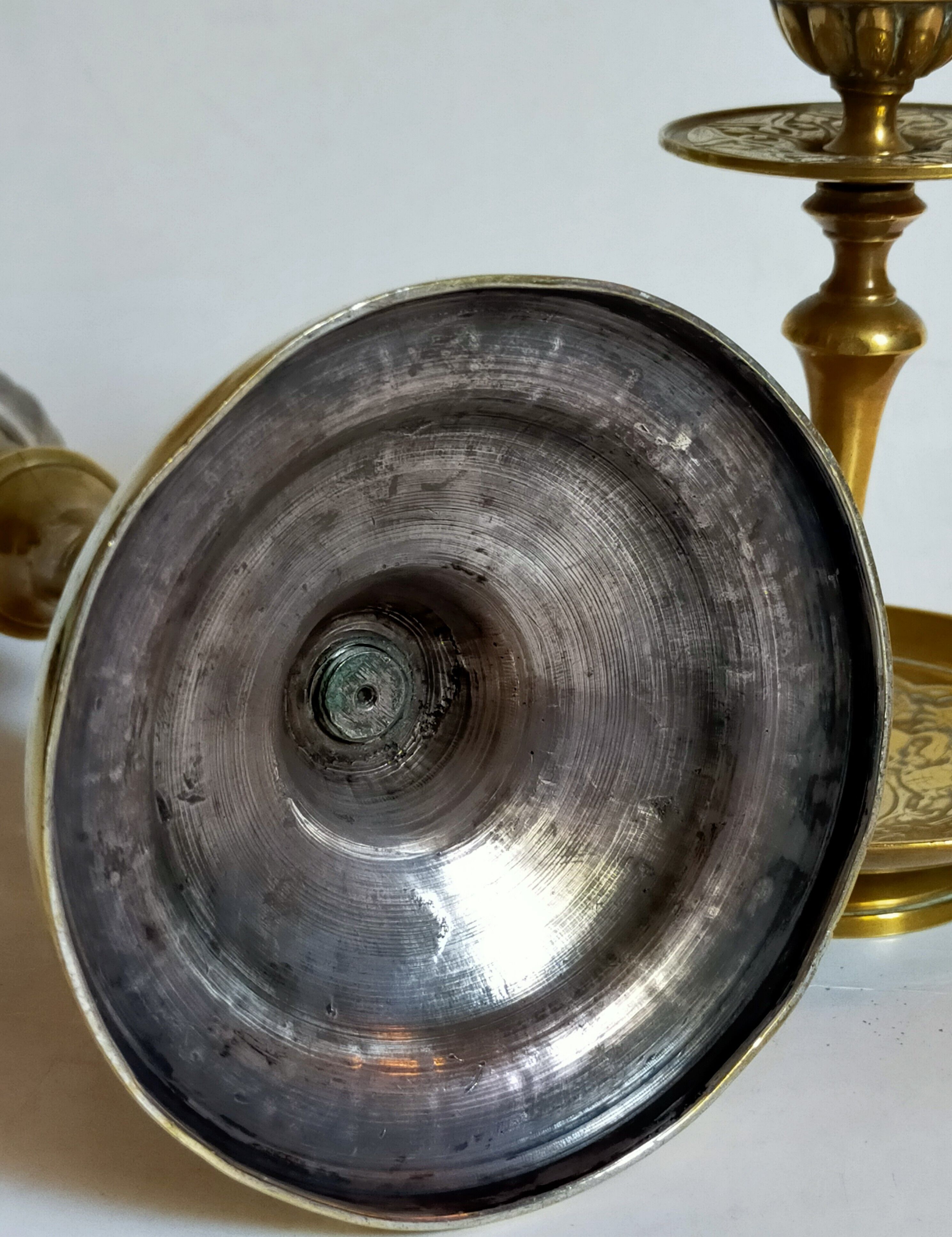 Duo of solid brass and gold metal candle holders worked old