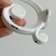 Set of 4 white lacquered metal hooks,