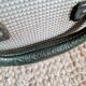 Old metal suitcase green leather handle