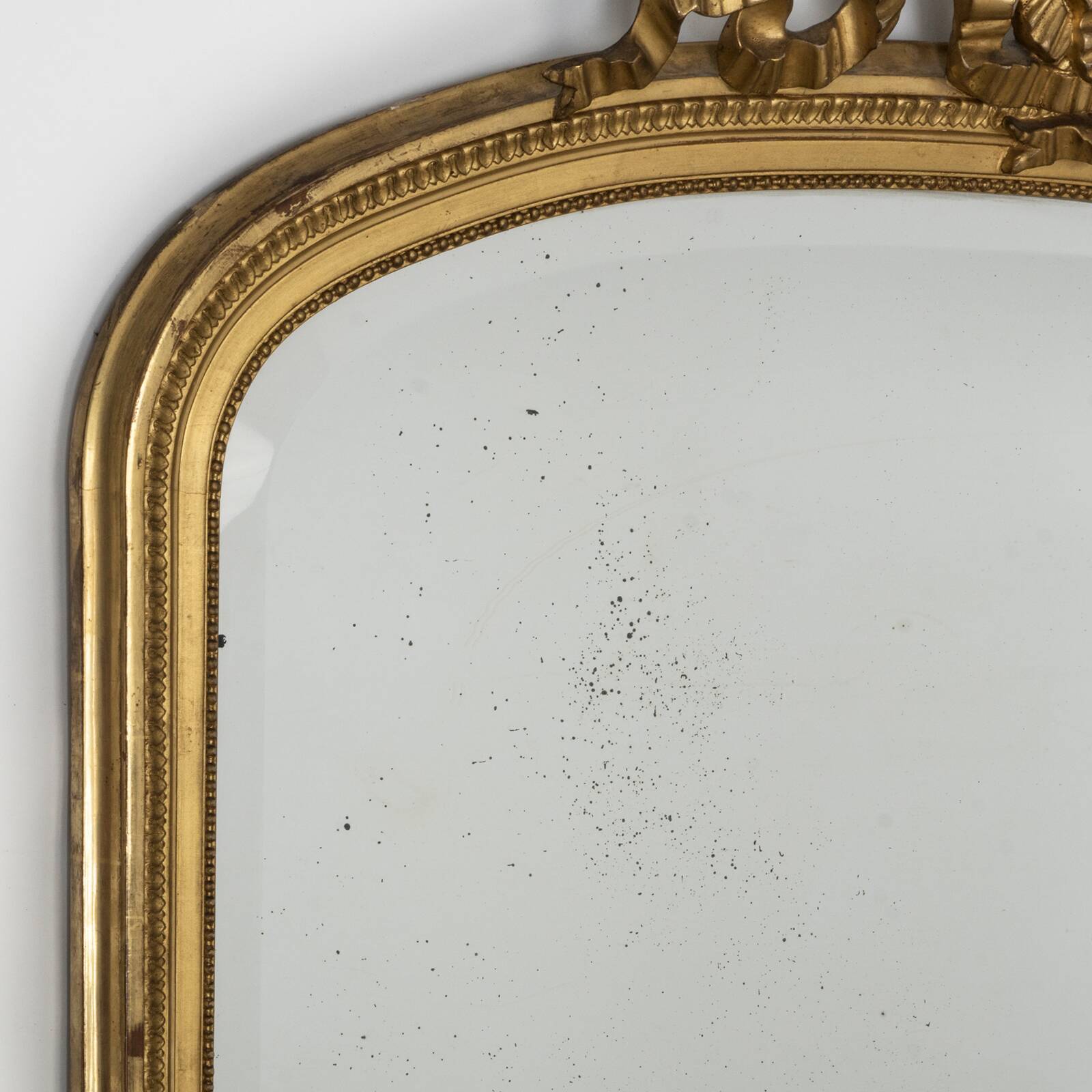 Large 19th c gilt wood bow cartouche mirror