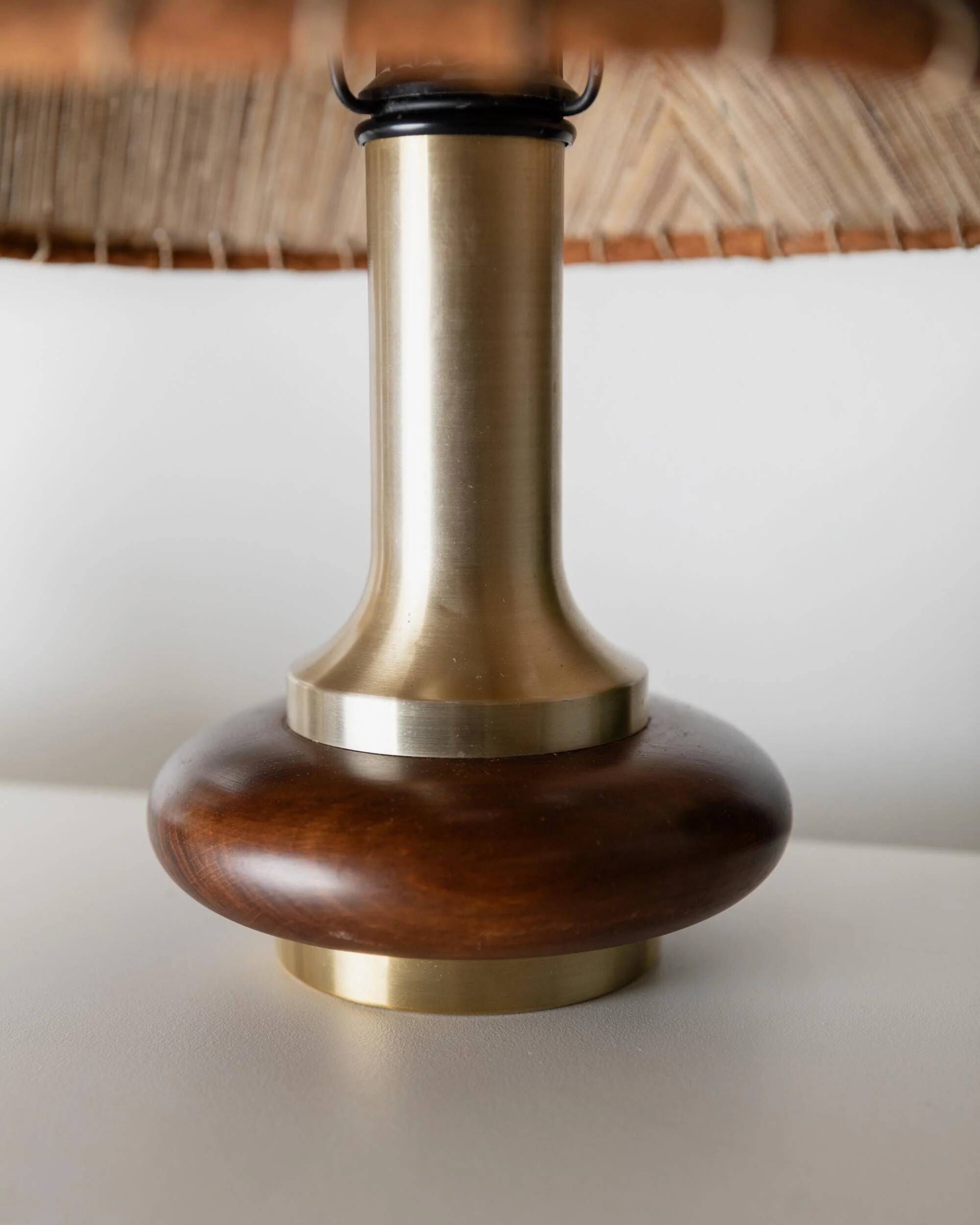Lot of 2 vintage table lamps from the 1970s, dark wood oval bases with curved brass details, handmade natural fibre lampshades, elegant lighting.