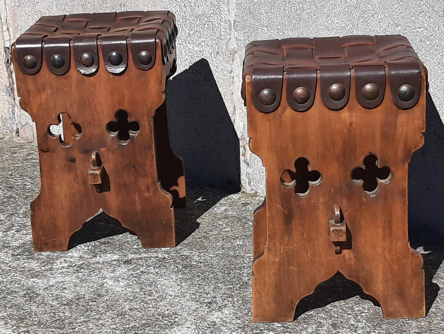 Pair of brutalist stools, leather seat.