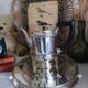 Old English coffee pot in silver-plated metal and Bakelite.