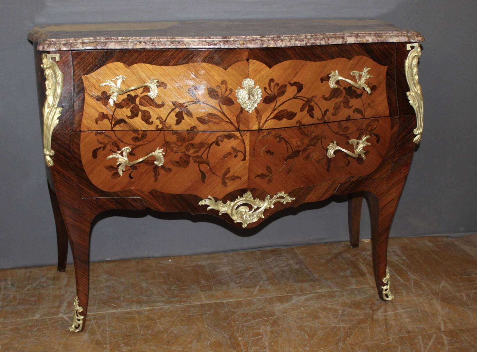 Louis XV style commode in marquetry from around 1930.