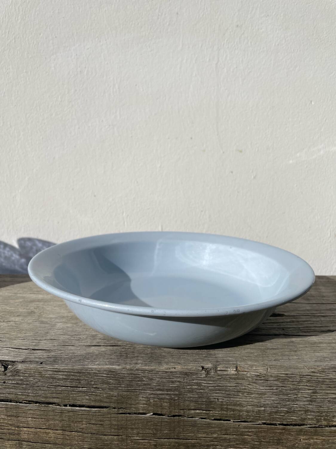 Round, flat, sky-blue ceramic salad bowl from Moulin des Loups