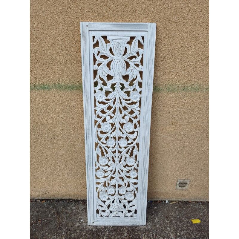 Decorative wooden panel with carved and openwork design.