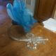 Art Deco style wall light in frosted blue glass with silver metal support.