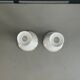 Pair of porcelain candlesticks with a gold pattern.