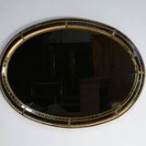 Miroir ovale à parclose en laiton, style hollywood regency – 1970