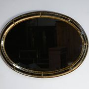 Miroir ovale à parclose en laiton, style hollywood regency – 1970