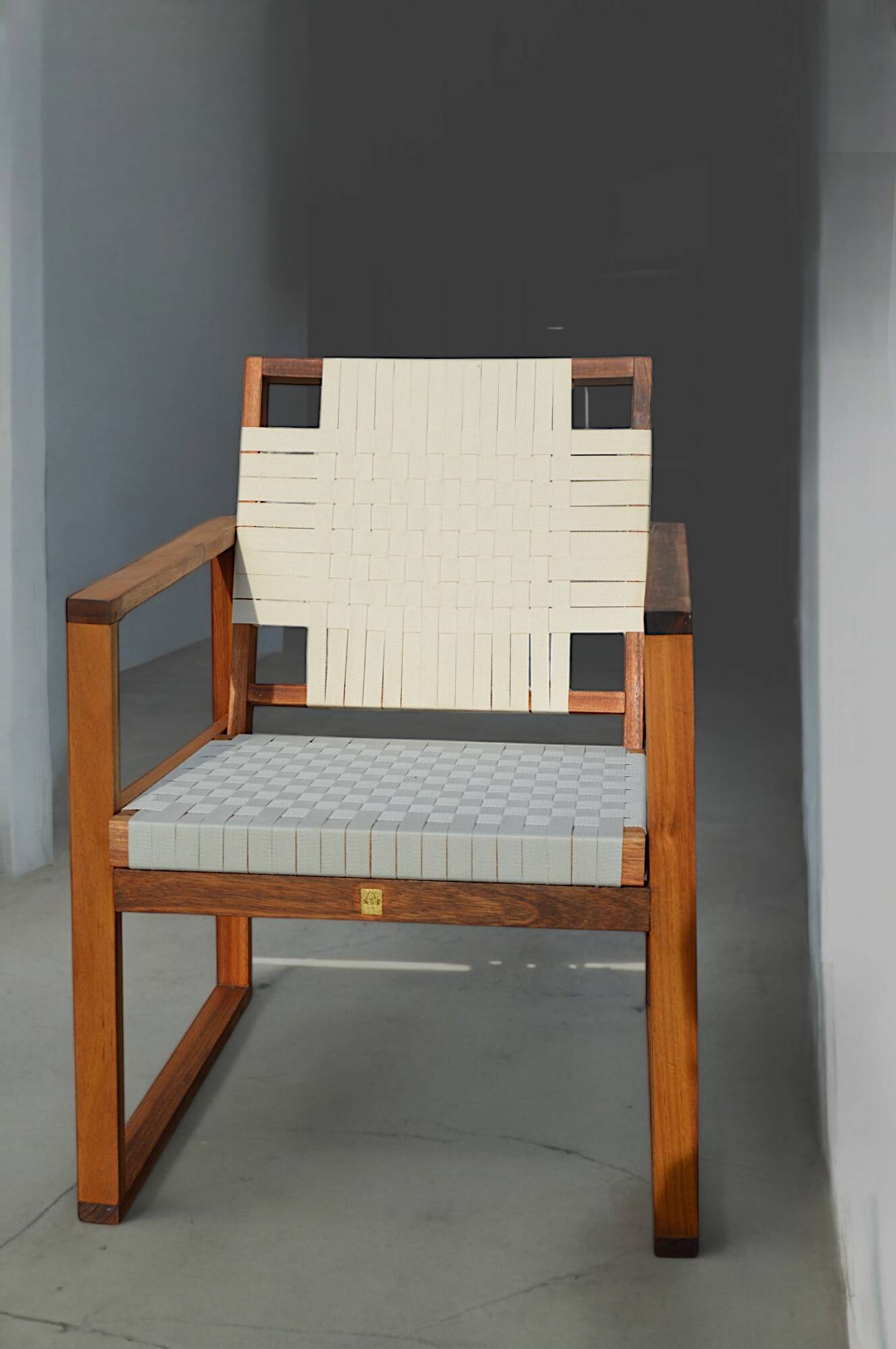 Teak armchair with woven seat